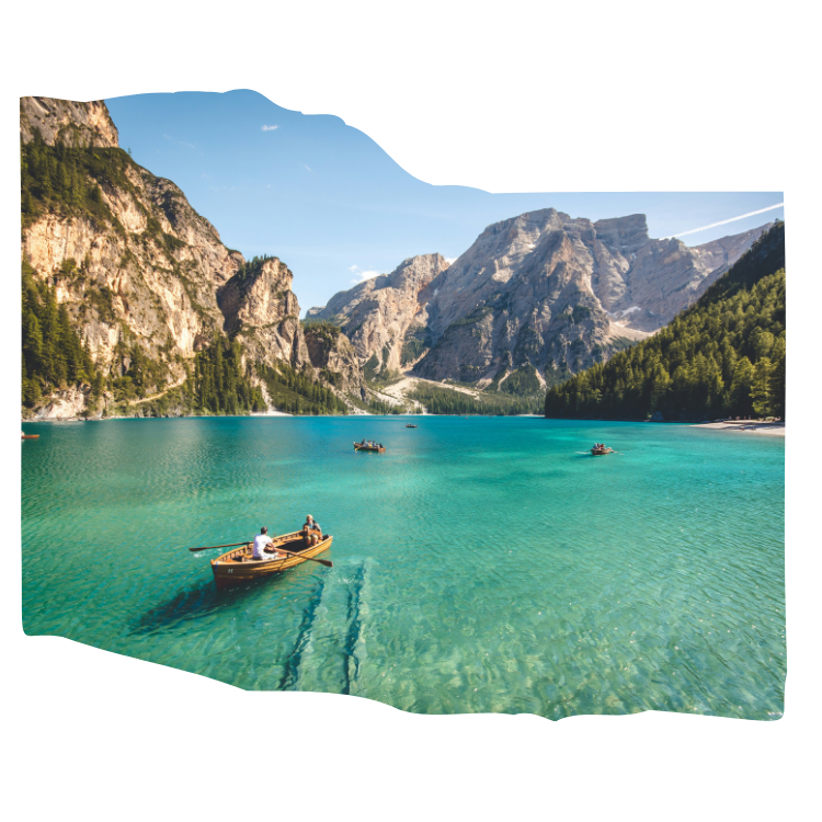 man travelling on a row boat on a lake